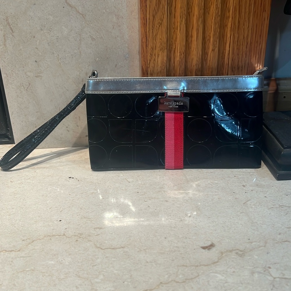 Black Kate Spade New York wristlet used once! Fits IPhone and Androids!